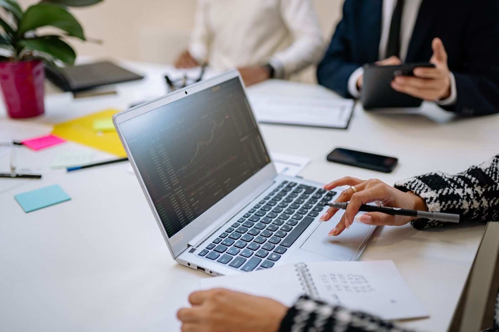 Professional coaching consultation with a laptop and planning materials